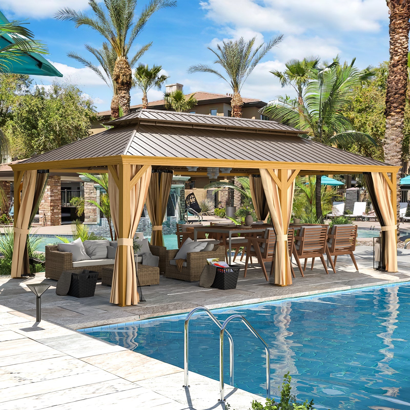 Outdoor gazebo with curtains by a poolside area with palm trees and lounge furniture.