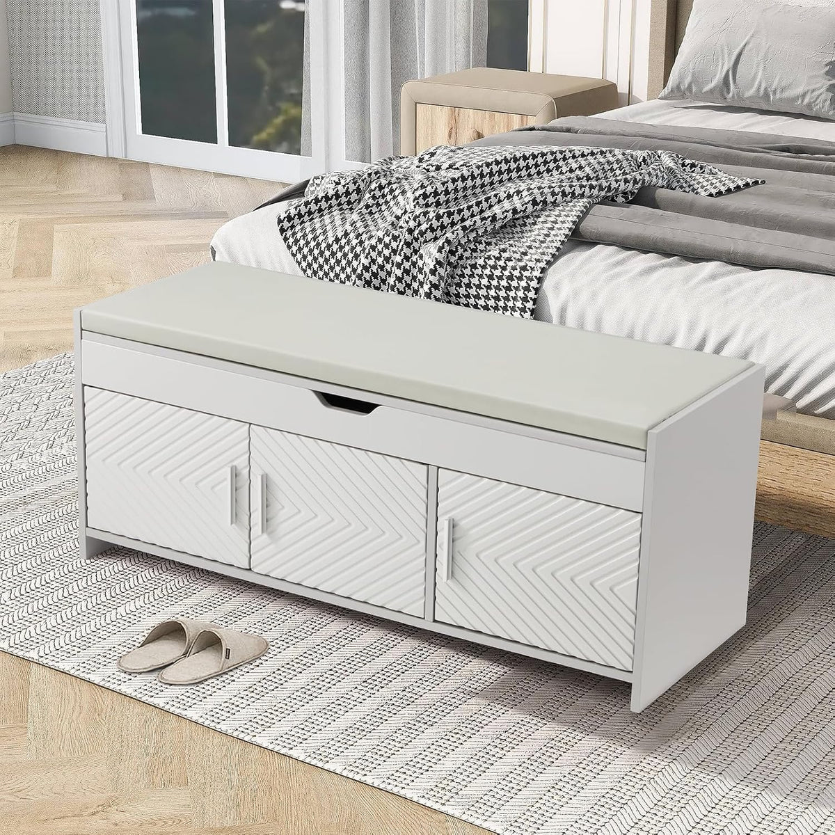 Light grey HOMREST shoe storage bench at the foot of a bed.